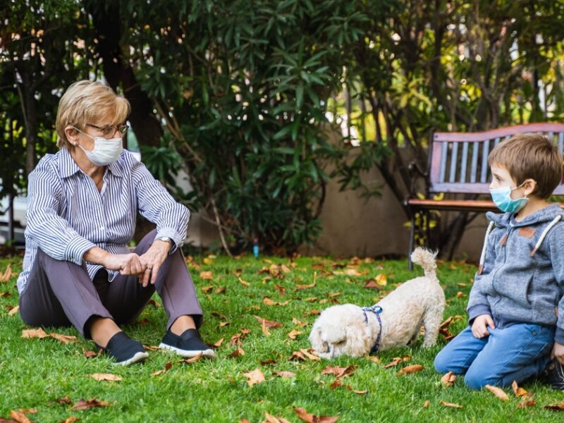 family outside with masks