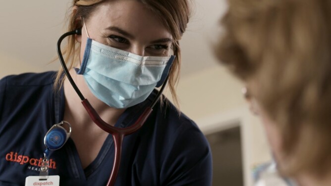 DispatchHealth nurse with stethoscope and mask