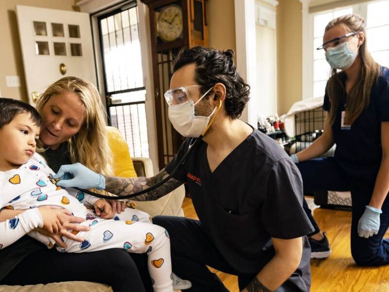 COVID team with child patient