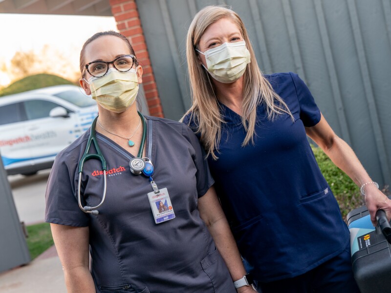 Two female DispatchHealth providers approaching patient's house.