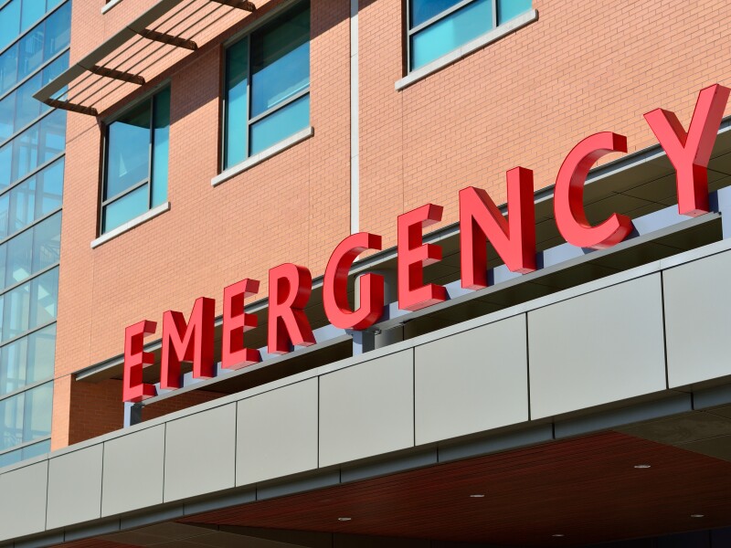 Hospital entrance with emergency sign